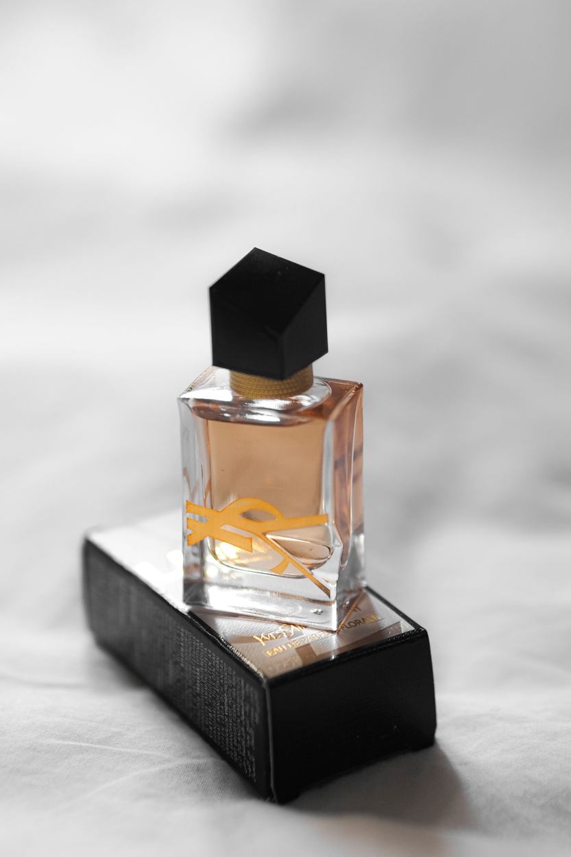 Perfume bottle on a black outer box, photographic reference